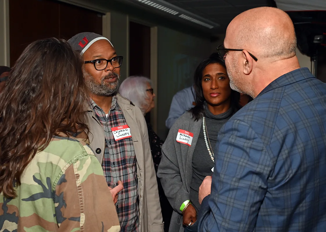 Four attendees in conversation at the Boulder County Film Commission fall event